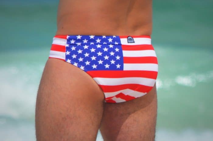 Man at the beach in an American flag Speedo