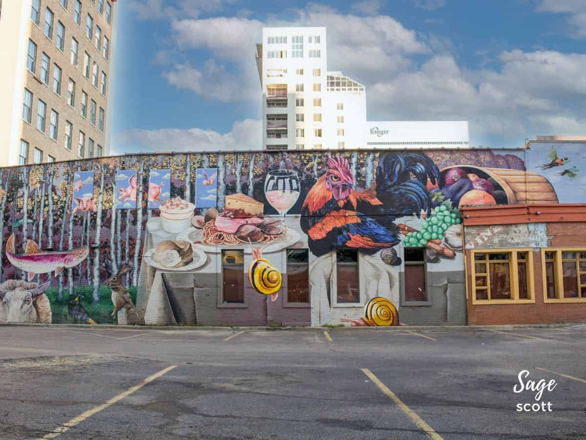 The Cincinnati’s Table​ mural features flying pigs, a symbol of Cincinnati