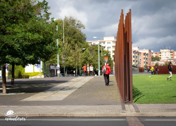 At the Berlin Wall Memorial, red steel rods mark where the Berlin Wall stood from 1961 to 1989.
