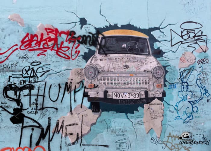The Trabant car bursting through the Berlin Wall to freedom is one of the most famous murals at the East Side Gallery. 
