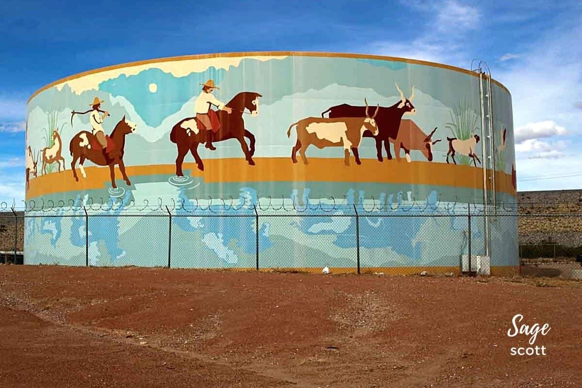 Horses run along the Rio Grande in this water tank mural