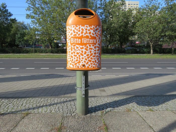 An orange trash can in Germany
