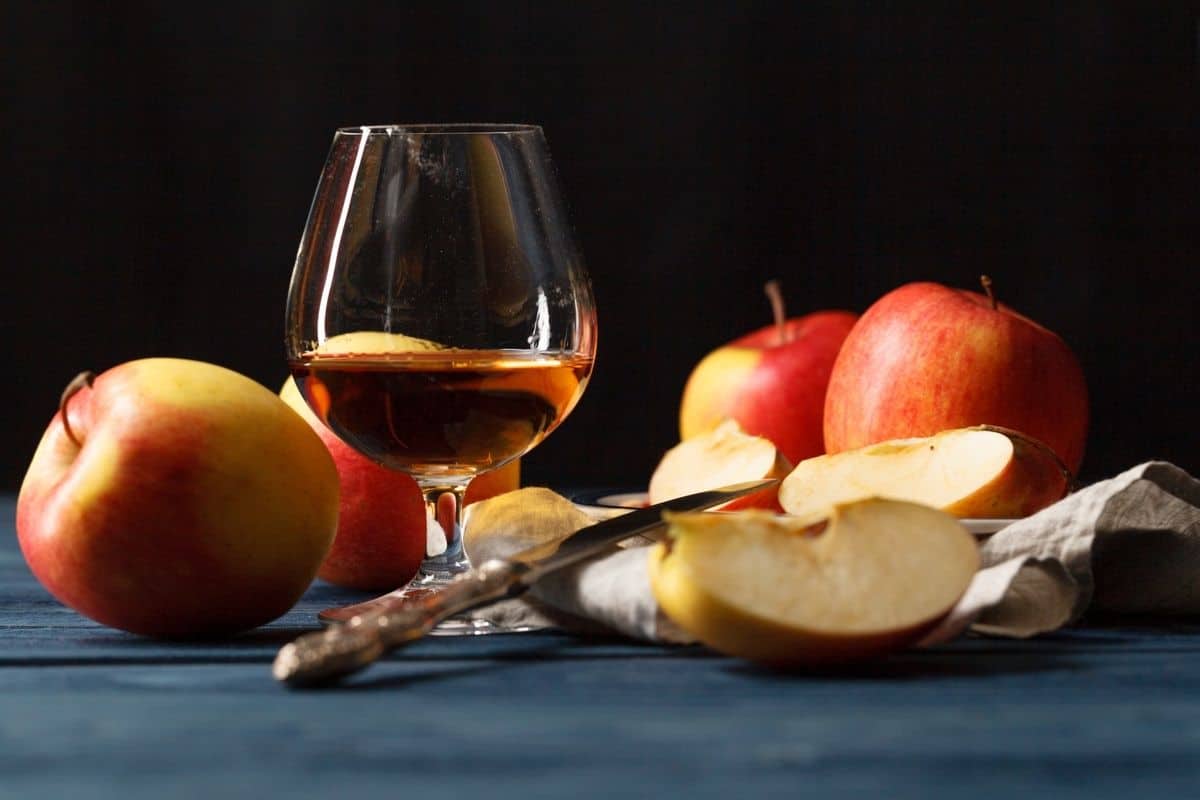 A glass of calvados with fresh apples