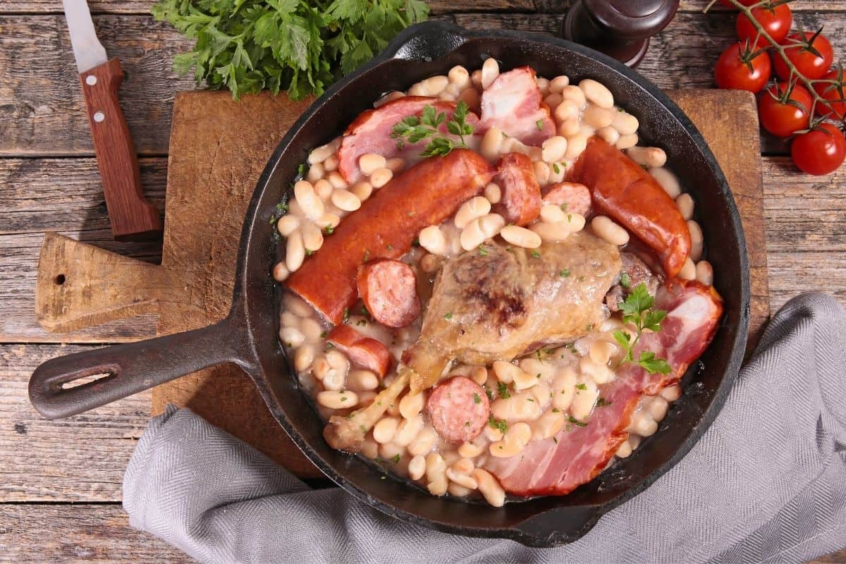 A cast iron skillet of traditional French cassoulet