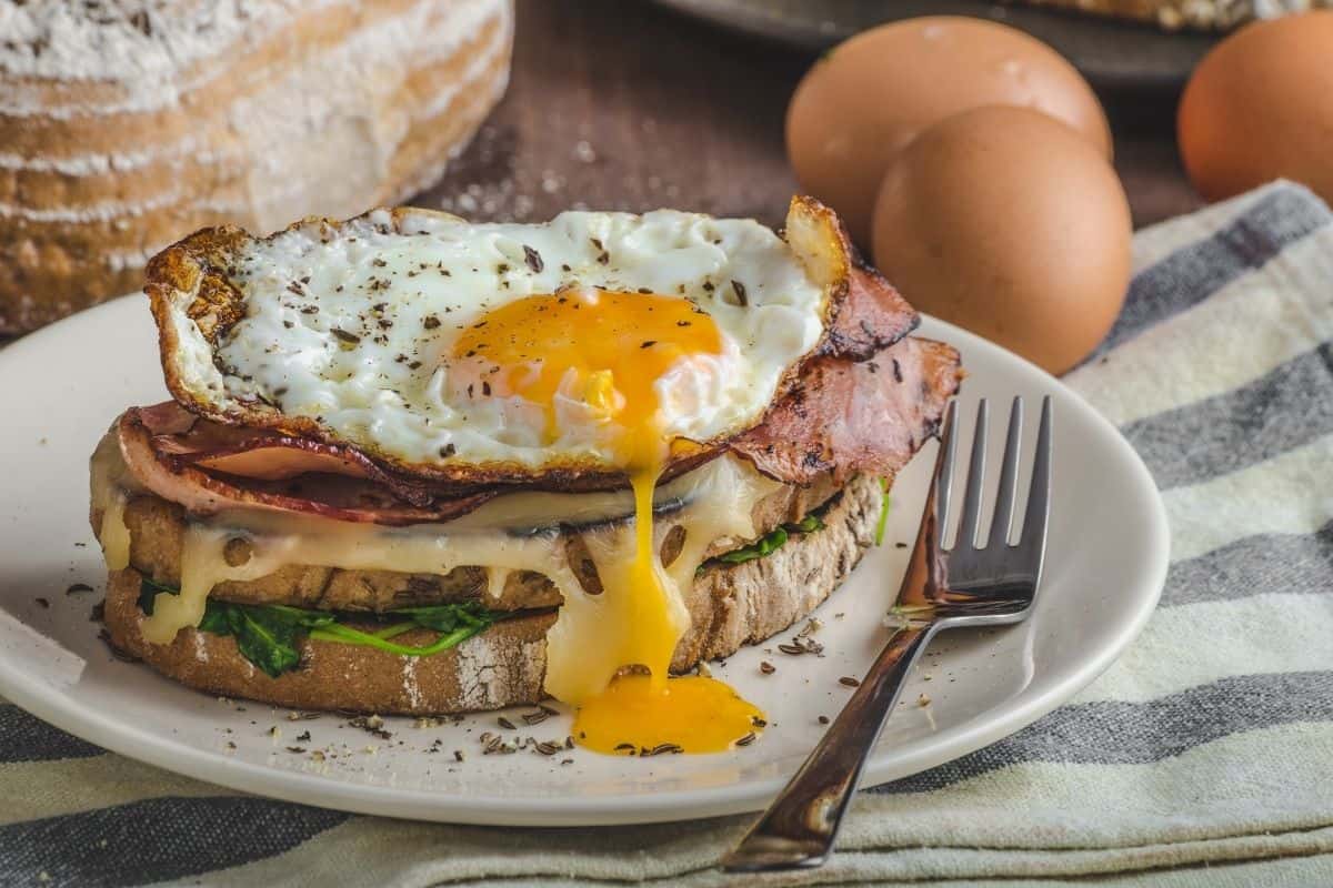 A croque madame is a croque monsieur topped with a fried egg