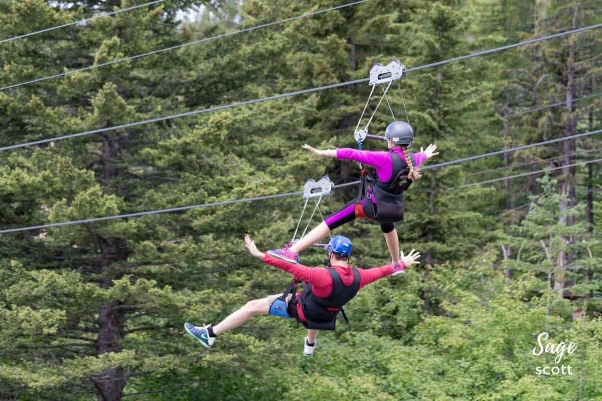 A father and daughter on the zipline at Whitefish Mountain Resort in Montana