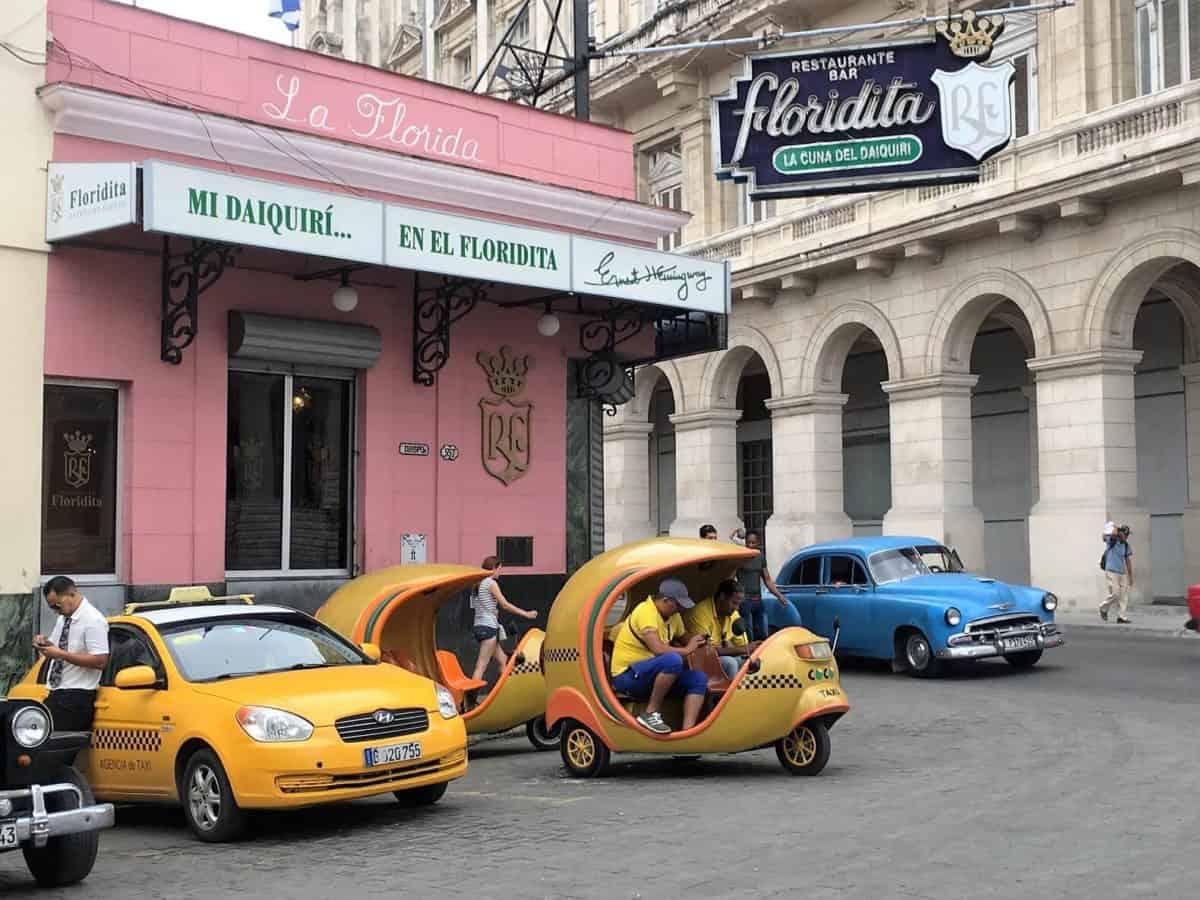 A Cocotaxi is an alternative mode of transportation to a classic American car in Havana