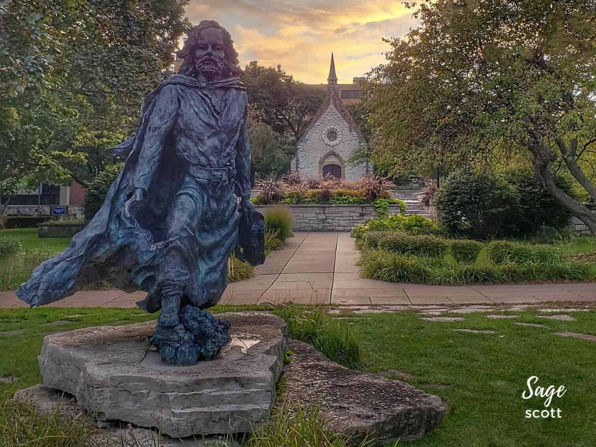 Bronze statue of Father Marquette and the St Joan of Arc Chapel at Marquette University