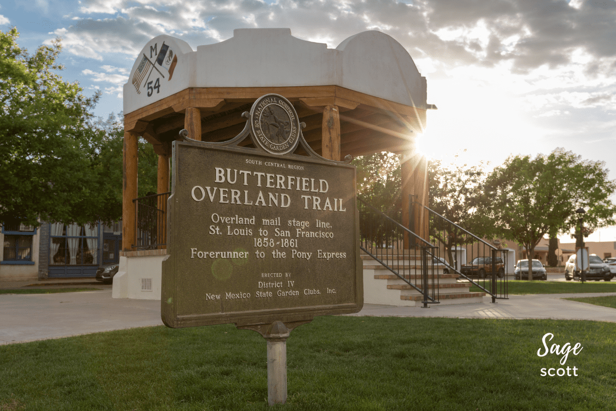 Gazebo in Mesilla with Butterfield Overland Trail sign with sun flare