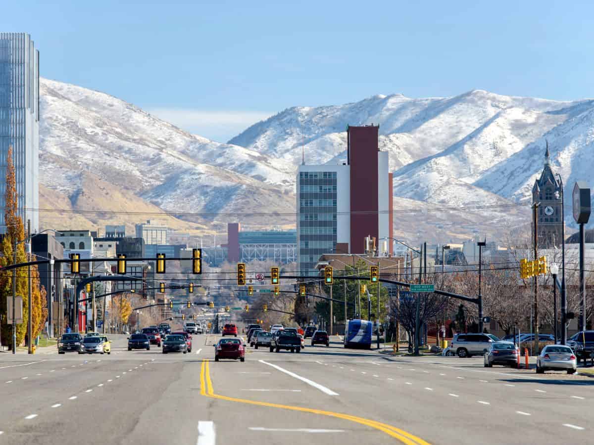 A Salt Lake City street with mountains in the background.