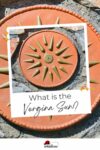 Decorative ceramic sun plaque mounted on a stone wall with text overlay asking "what is the vergina sun?.