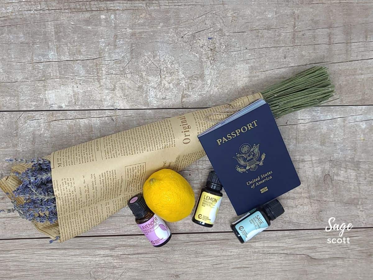 Essential oils with a US passport and bouquet of dried lavender flowers