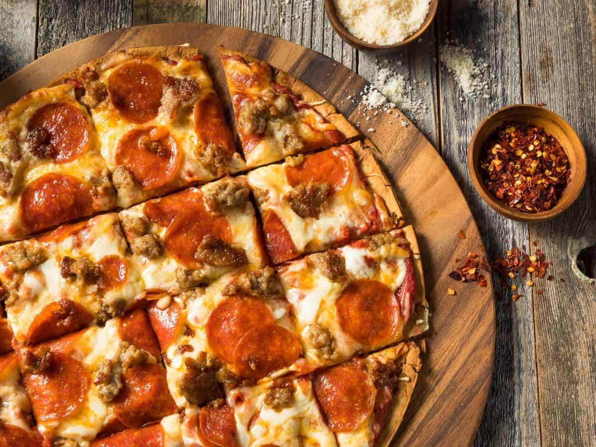 St. Louis style pizza on a wooden table.