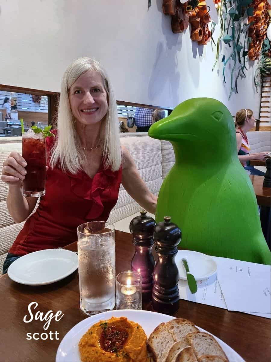 Sage Having a Cocktail with a Green Penguin at 21c Bentonville