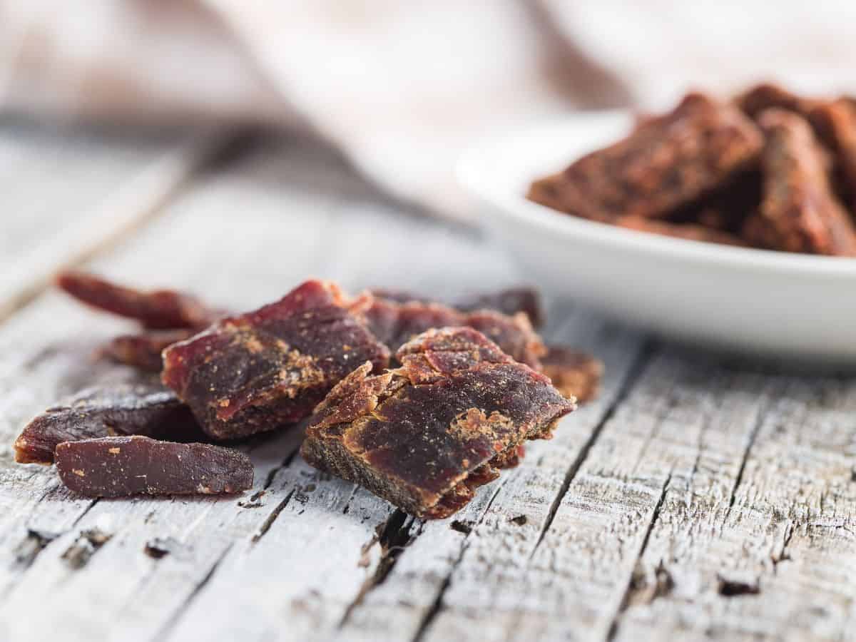 Bowl of Jerky on Wooden Table