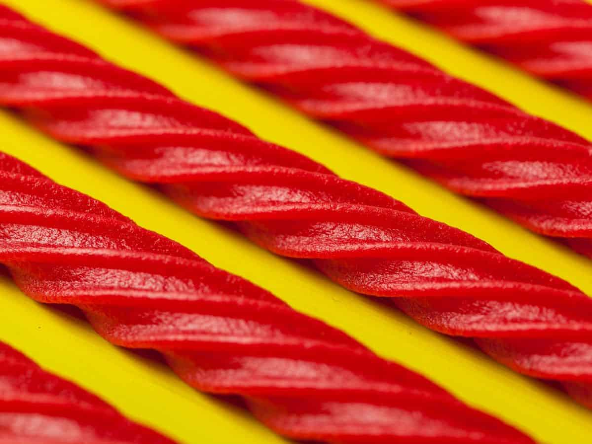 Red Licorice on a Bright Yellow Background