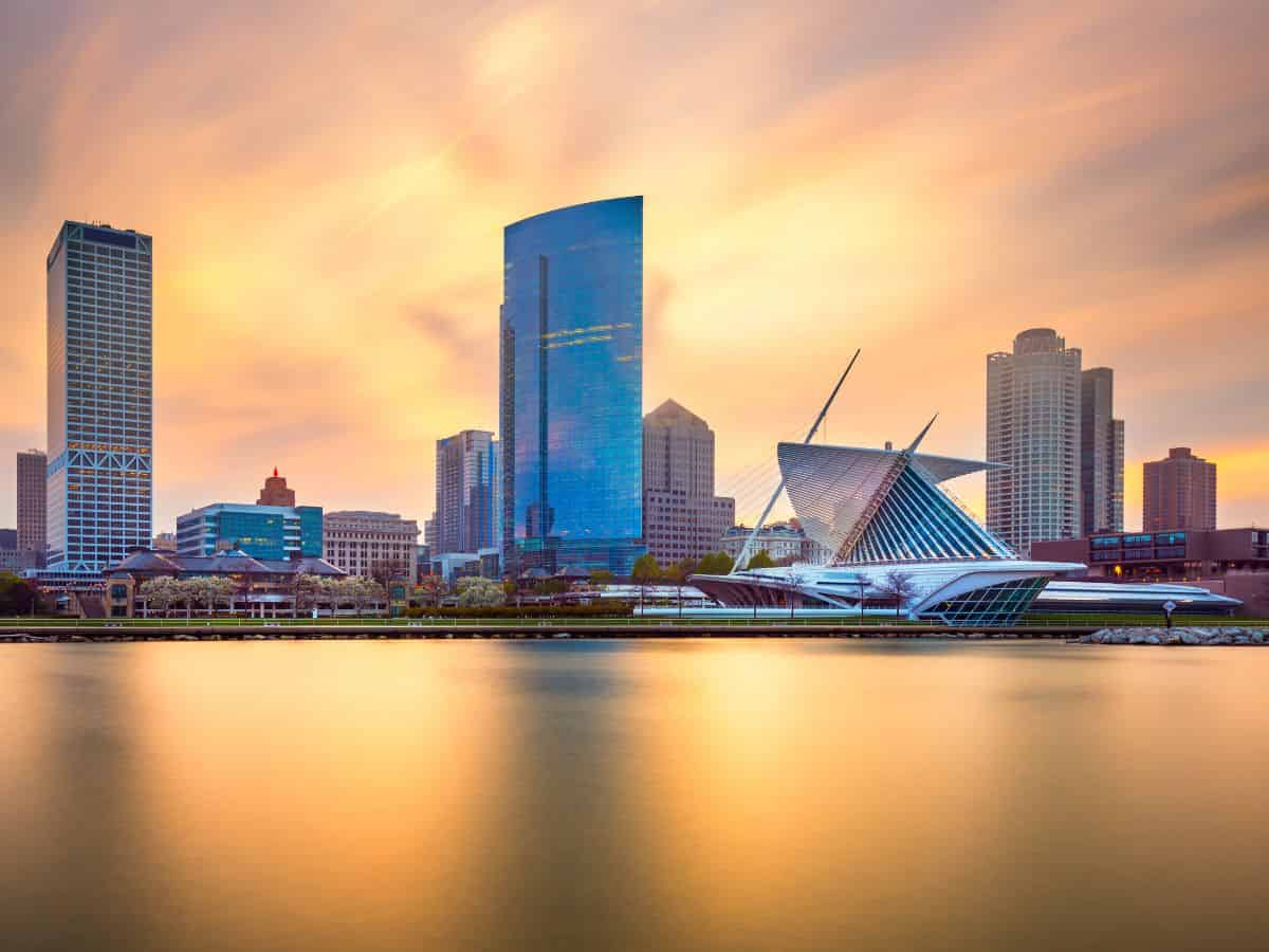 Milwaukee Wisconsin skyline across Lake Michigan at golden hour