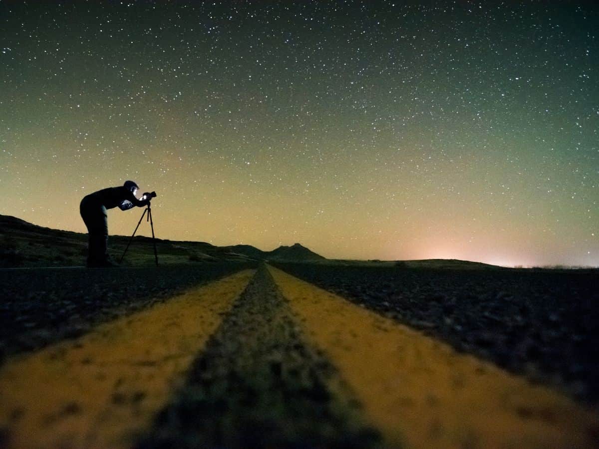 Person Taking Photos of Night Sky