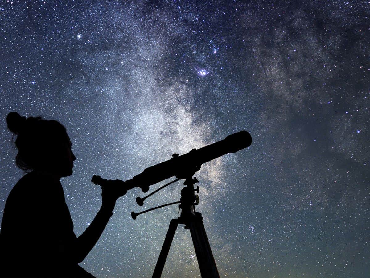 Woman Looking through Telescope