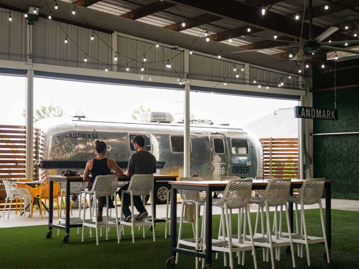 People in dining area at Mother Road Market in Tulsa, Okla.