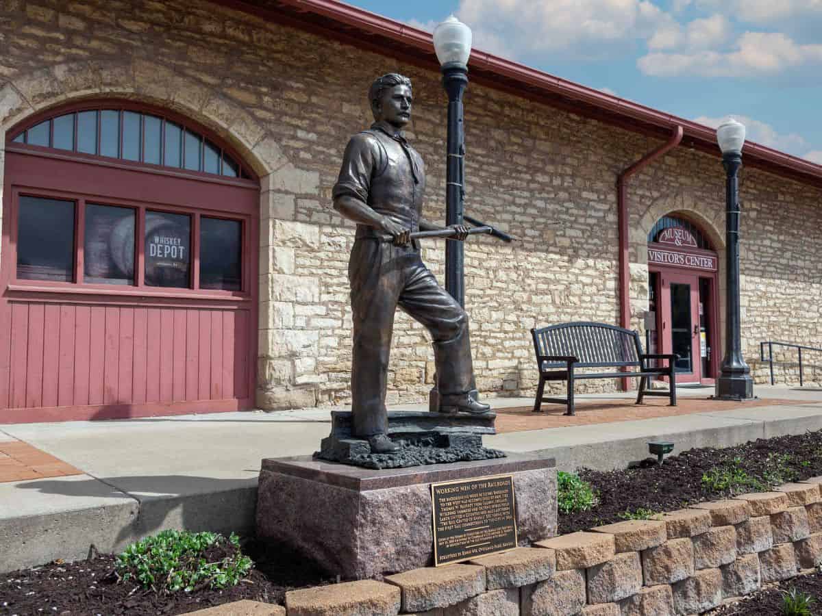 A railroad worker stands outside the Atchison County Historical Society Museum in Atchison, KS.