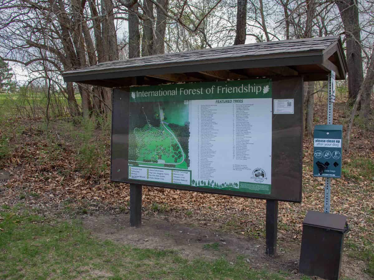 A sign listing all of the trees and their origin at the International Forest of Friendship in Atchison, KS.