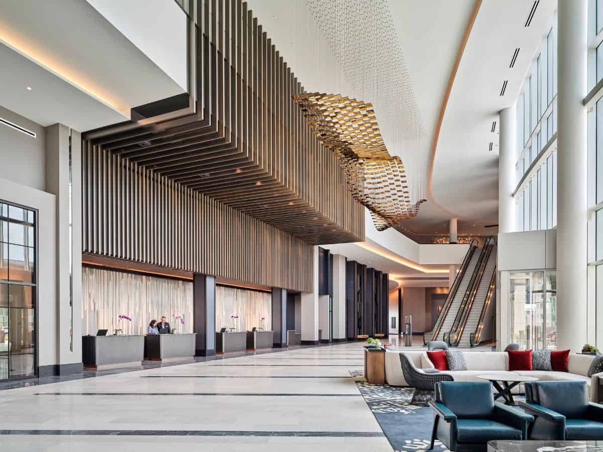 The lobby of the Loews Kansas City Hotel features high ceilings.