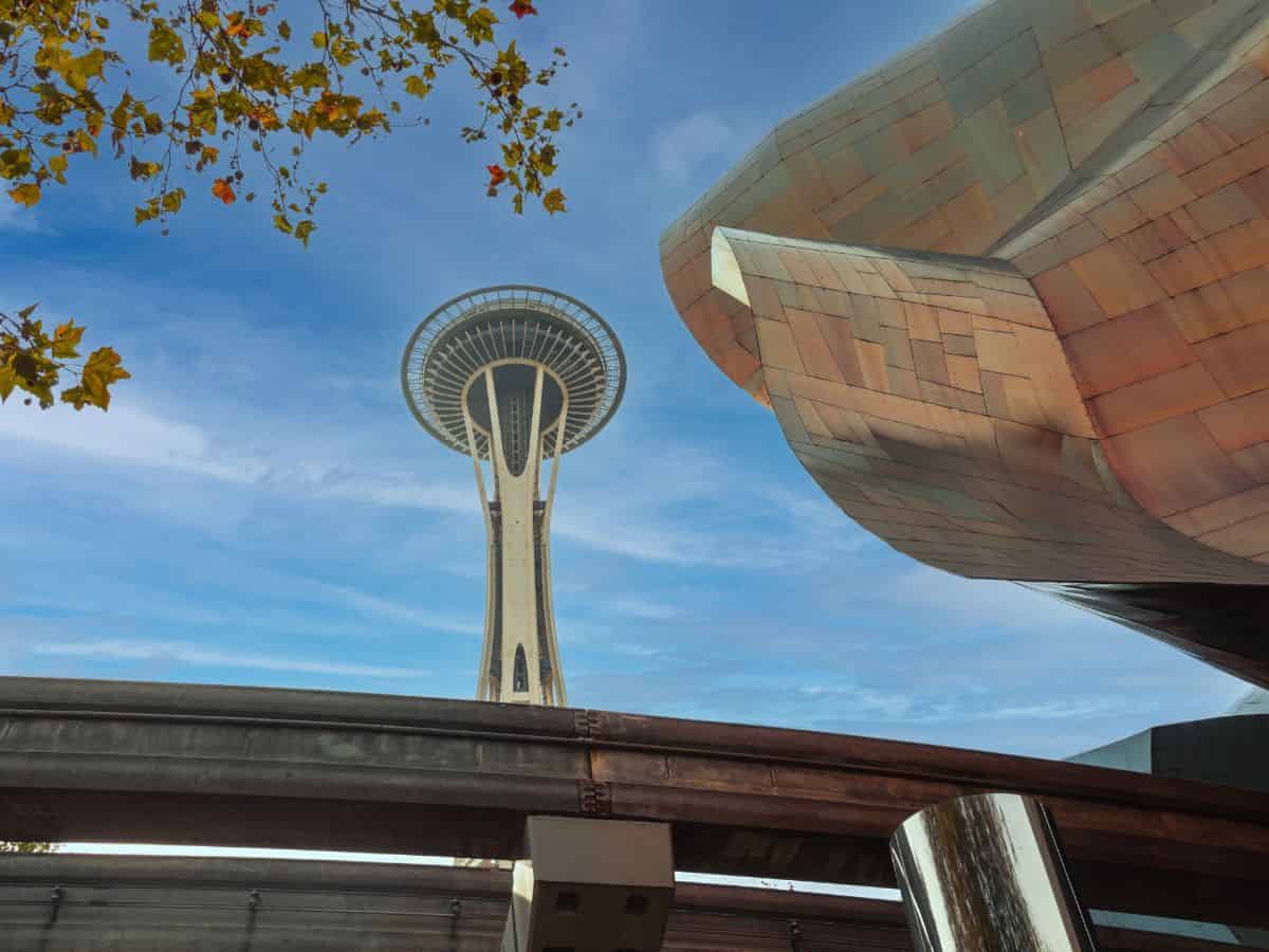 The iconic Space Needle in Seattle, Washington, framed by the Monorail and Museum of Pop Culture.