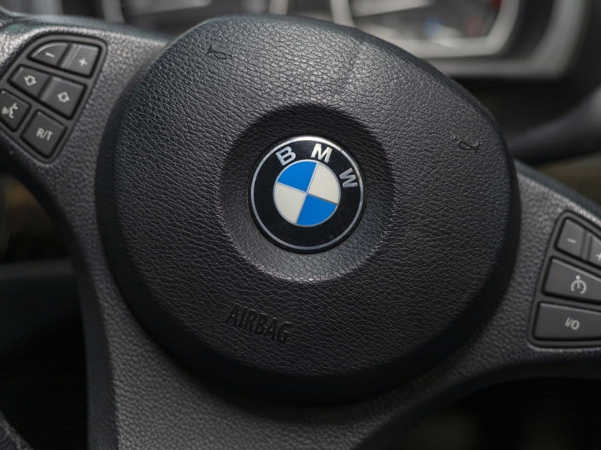 A close up of the steering wheel of a BMW.