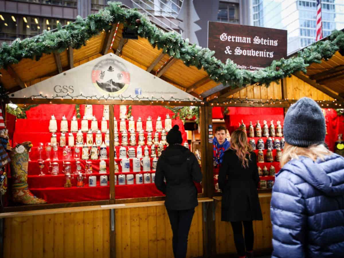 A group of people in line at a booth at the Christkindlmarket Chicago.