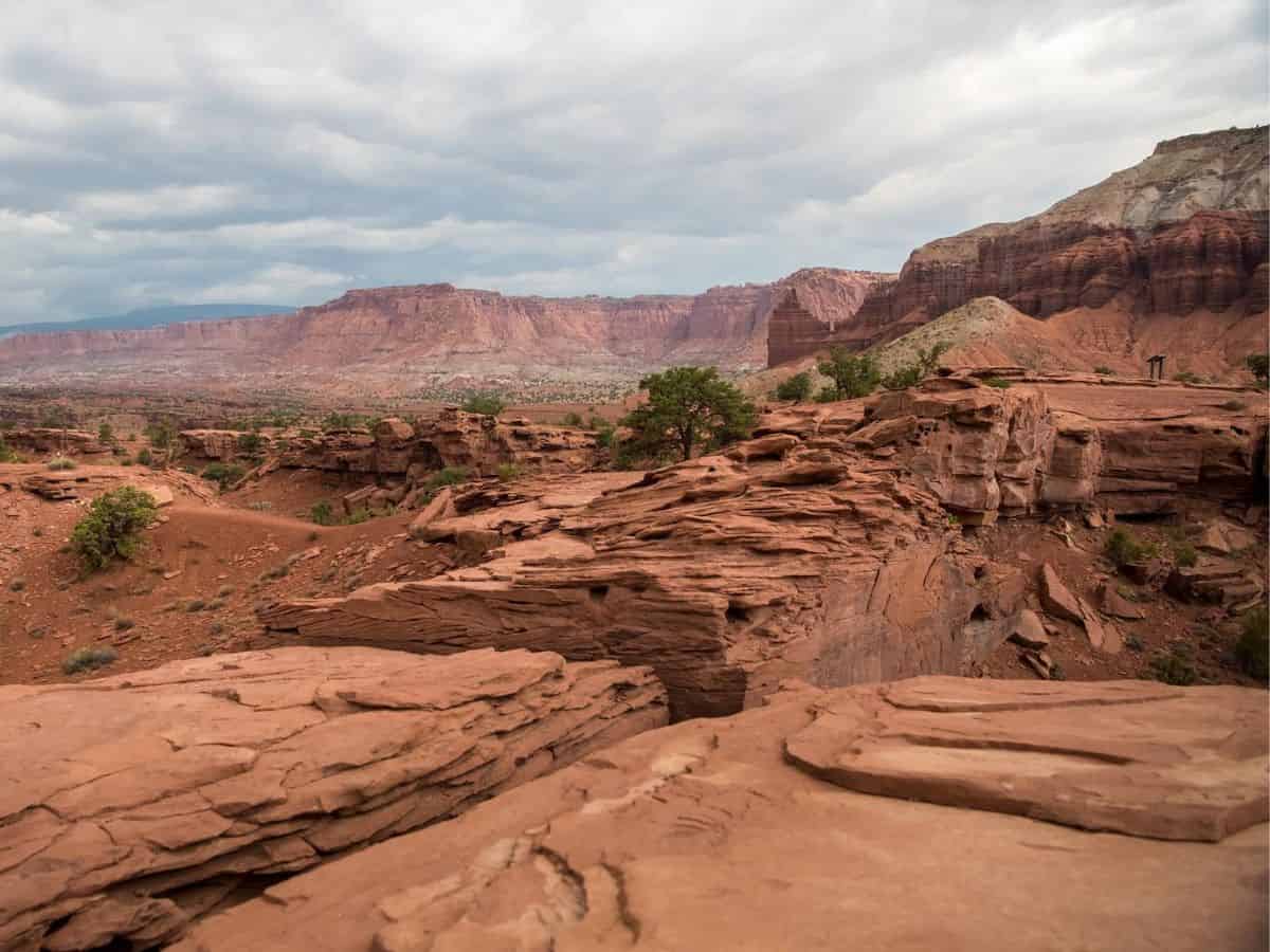 Utah's red rock canyons, framed by a picturesque cloudy sky.