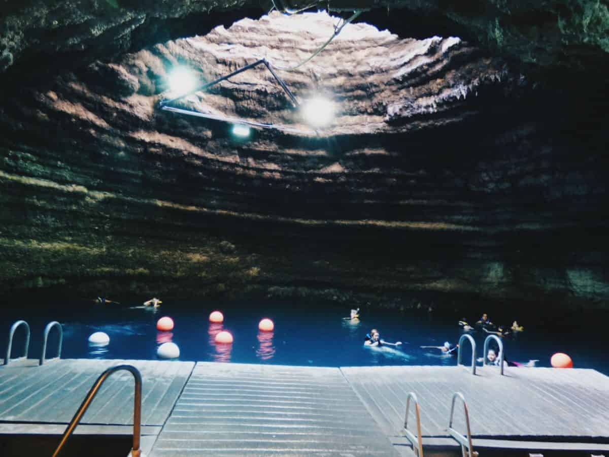Discover the thrilling adventure of swimming in a cave at the Homestead Crater, one of the best things to do in Utah.
