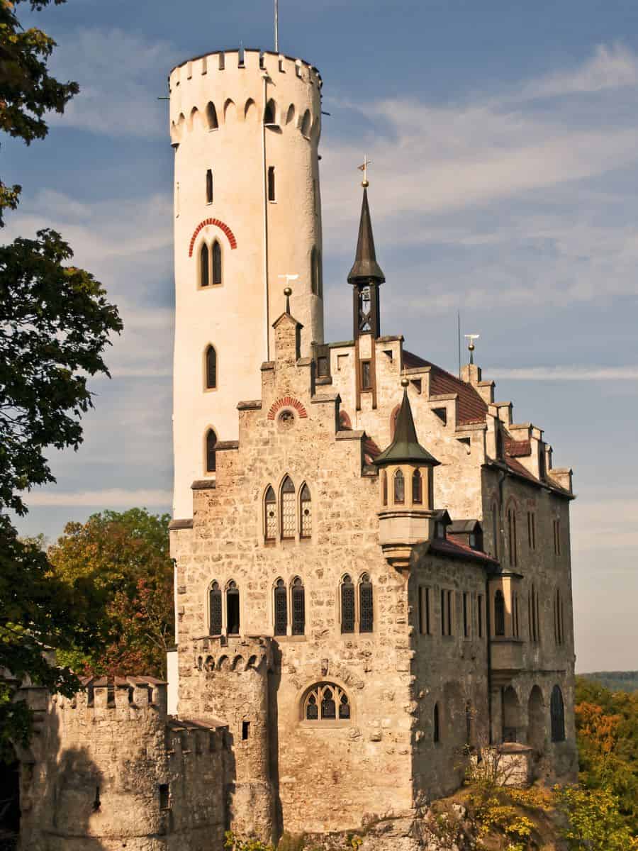 A German castle sits on top of a cliff.