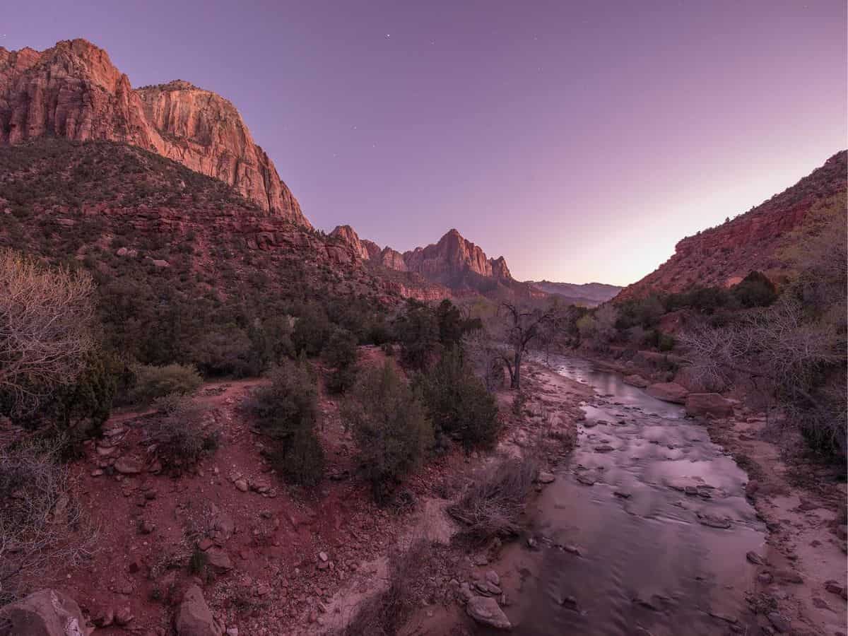 The Virgin River winding through Zion National Park at sunset.