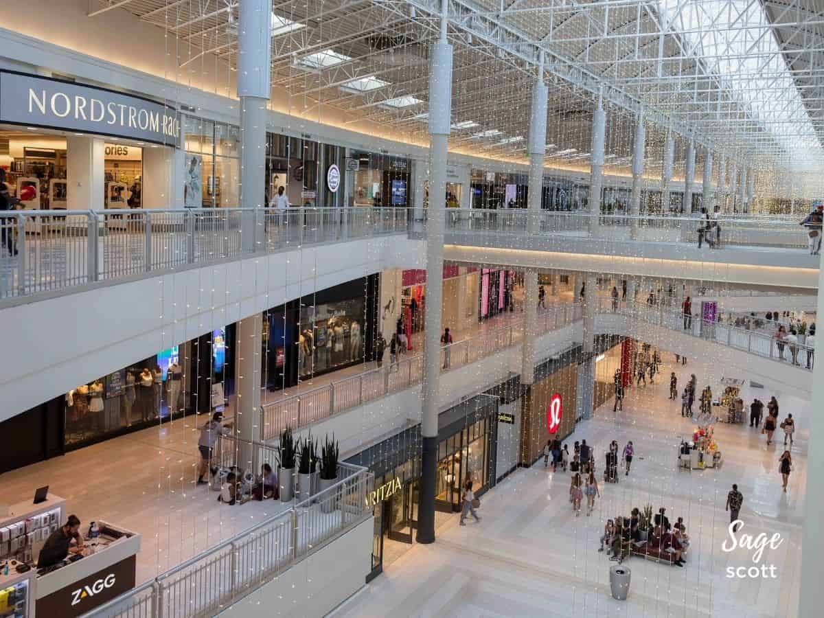 The Mall of America, one of the largest shopping malls in the world, is bustling with countless individuals strolling around its vast expanse.