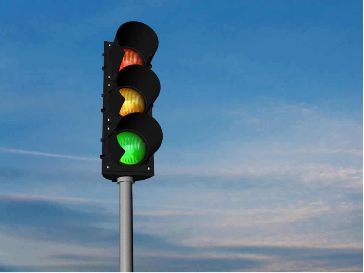 A traffic light on a pole.