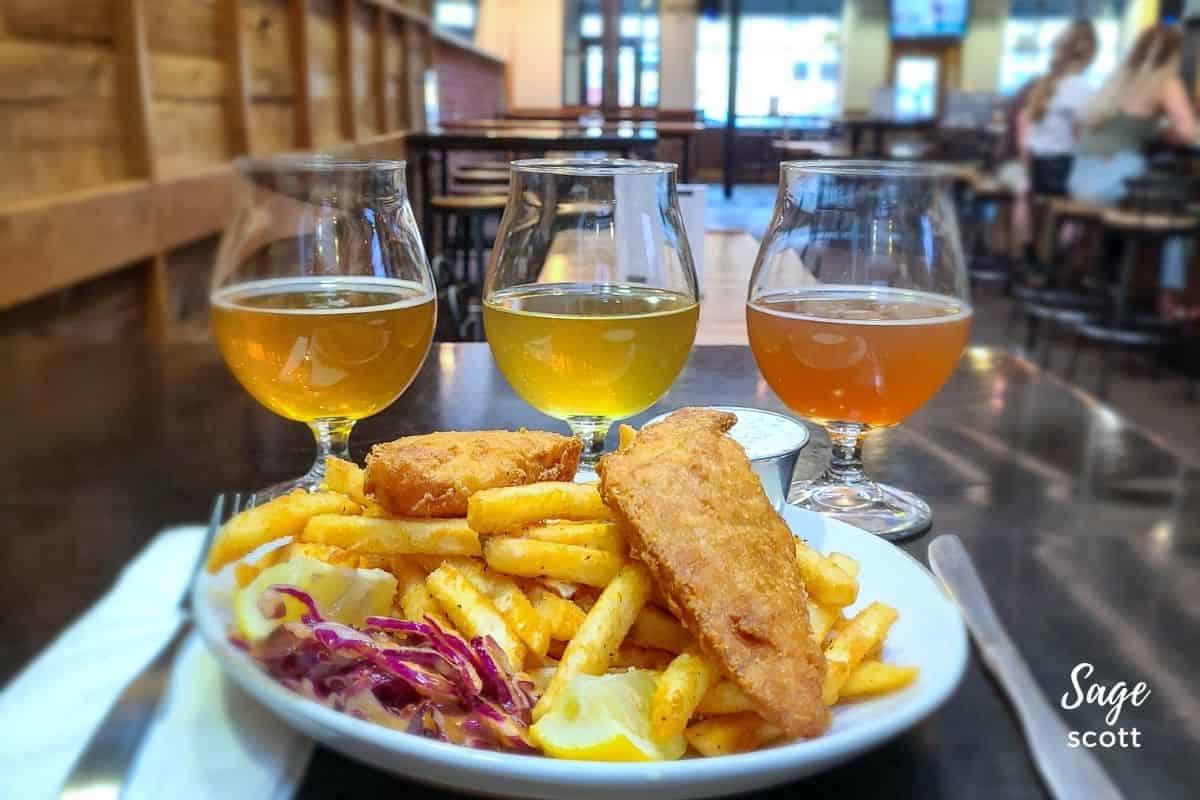 A plate of fish and chips accompanied by two glasses of beer, perfect for enjoying fun facts about Montana.
