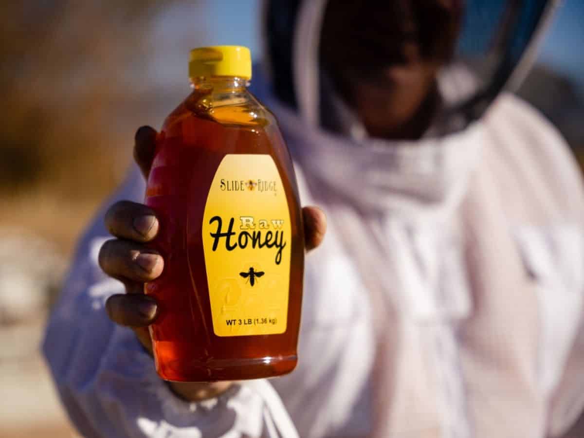 A beekeeper showcasing Utah's famous honey.