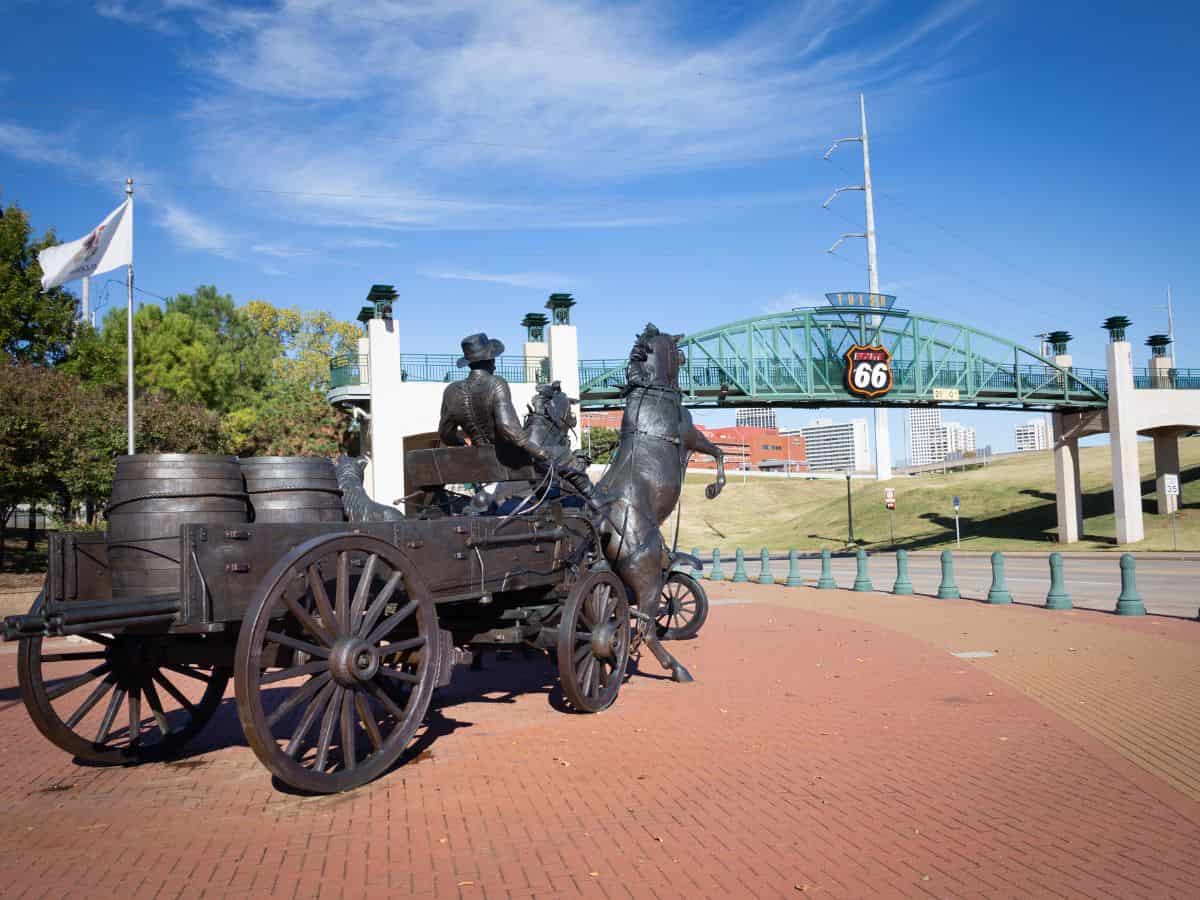 A statue of a horse drawn carriage along Route 66 Tulsa.