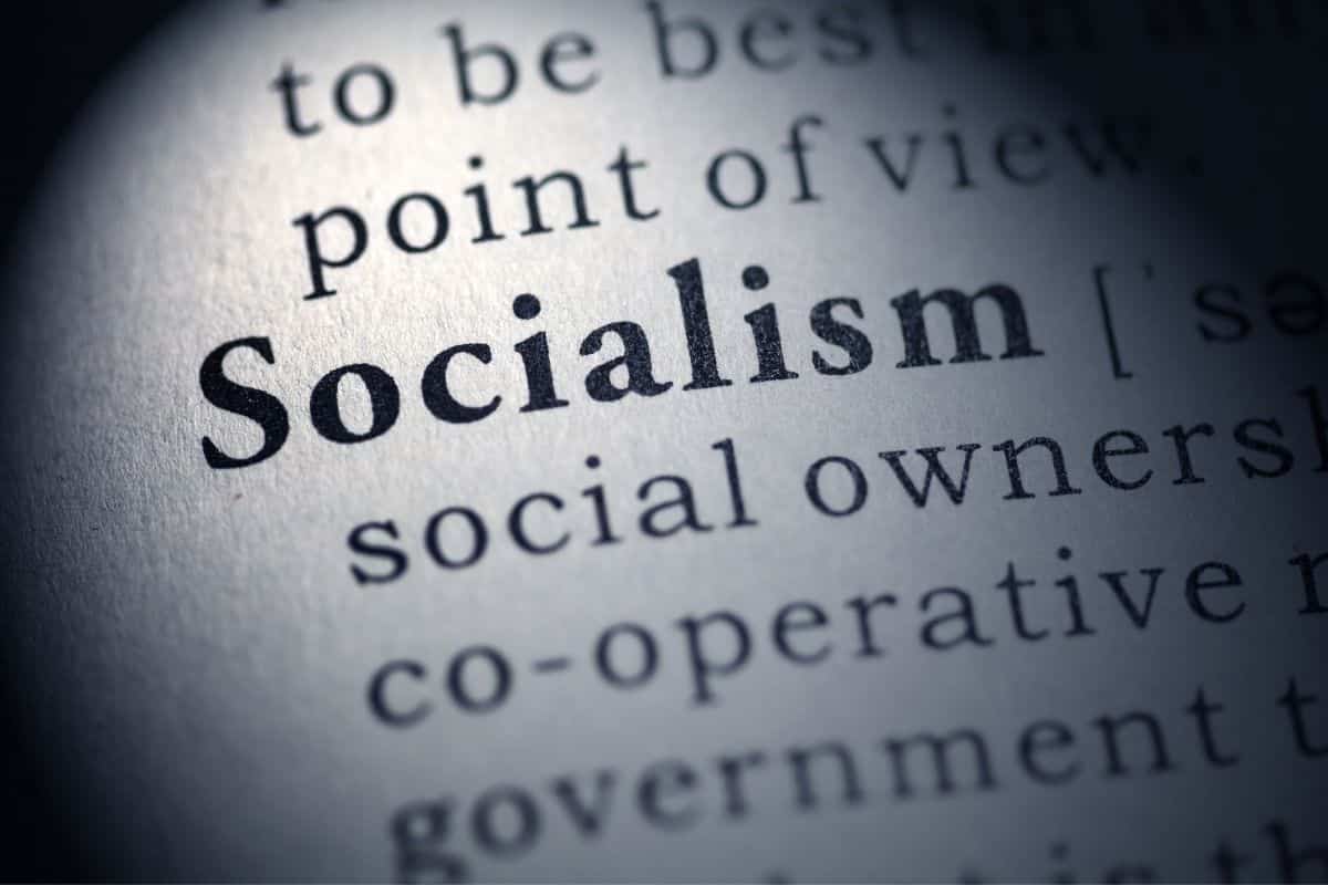 The word socialism is shown through a magnifying glass.