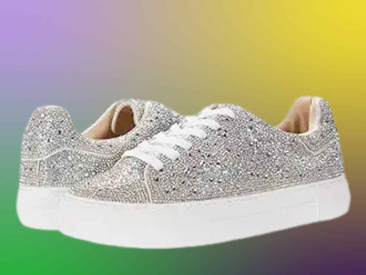 A pair of silver sneakers on a colorful Mardi Gras background.