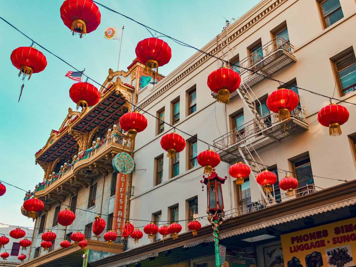 Red lanterns hanging over a street in San Francisco's Chinatown.