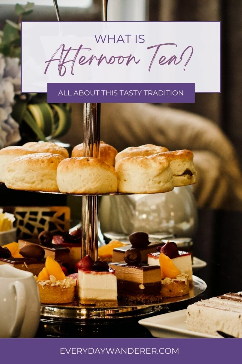 A three-tiered serving tray filled with scones, sandwiches, and desserts presented for afternoon tea.