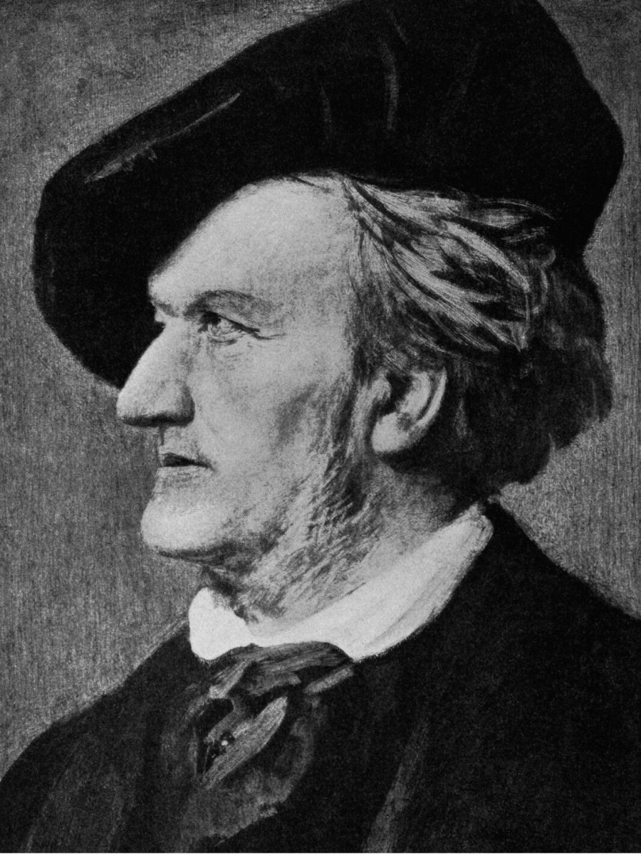A grayscale portrait of an older man in profile, wearing a dark hat and a collared shirt with a necktie.