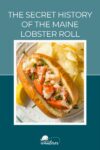 A lobster roll with a lemon wedge and chips on a plate. Text above reads, "The Secret History of the Maine Lobster Roll.