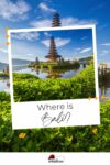 A scenic view of an island temple on water, surrounded by lush greenery and mountains under a bright blue sky with the caption "Where is Bali?" and a travel logo at the bottom.